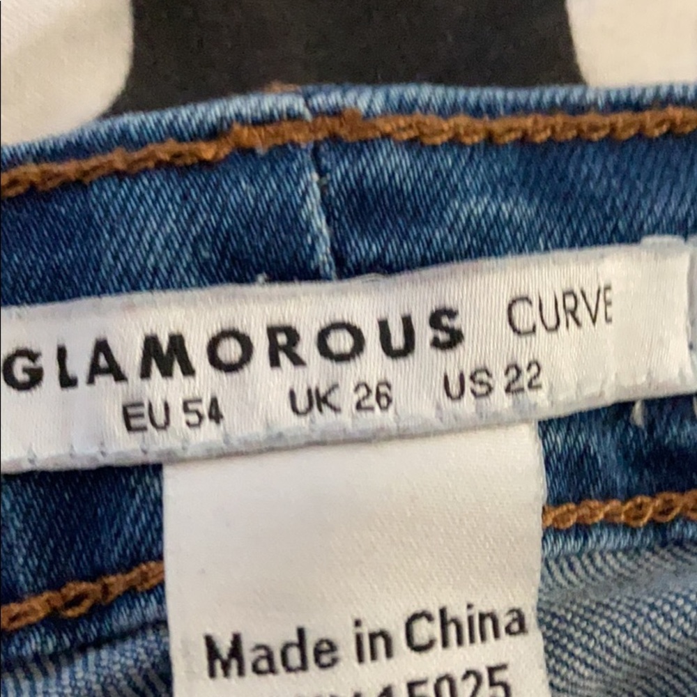 Women’s 22W jeans with distressed knees, 0 worn